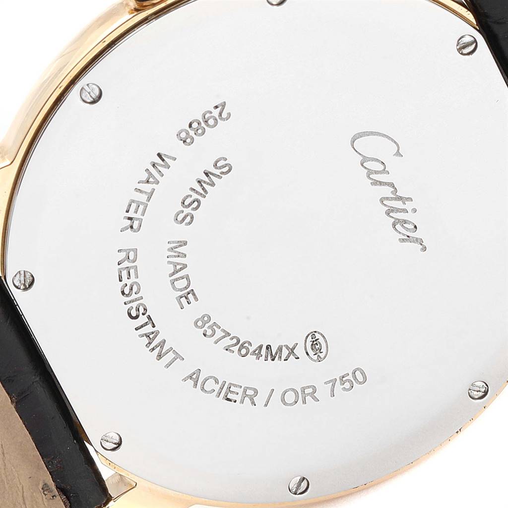 This image shows a close-up of the back case of a Ronde model Cartier watch, highlighting its engravings.
