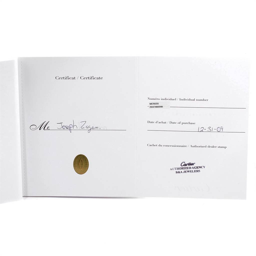 This image shows an open warranty card for the Cartier Ronde W6700255 Men's Stainless Steel Silver Dial W6700255 Men's Stainless Steel Silver Dial model watch, detailing purchase information and an authorized dealer stamp.