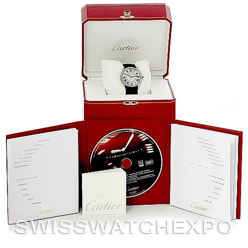 The image shows a Cartier Ronde W6700255 Men's Stainless Steel Silver Dial W6700255 Men's Stainless Steel Silver Dial watch in its box, accompanied by manuals and a CD, all displayed front-facing.