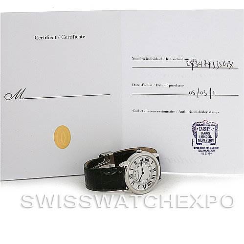 This image shows the Cartier Ronde W6700255 Men's Stainless Steel Silver Dial W6700255 Men's Stainless Steel Silver Dial watch, laid flat with an open certificate displaying purchase details beside it.