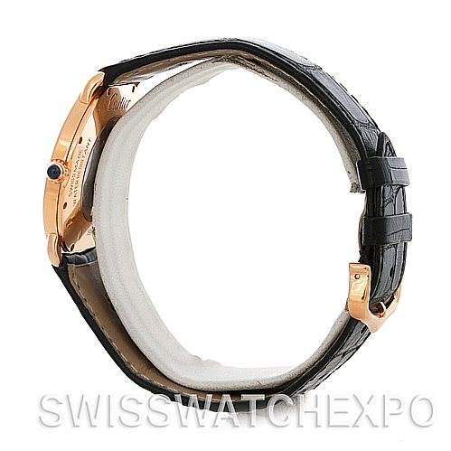 This image shows a side view of a Cartier Ronde W6800251 Men's Rose Gold Silver Dial W6800251 Men's Rose Gold Silver Dial watch, focusing on the case, crown, and black leather strap.