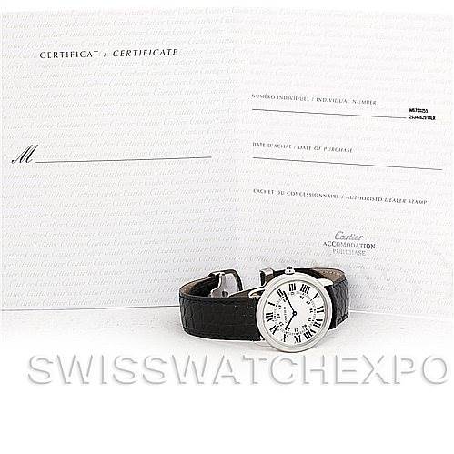 The image shows a Cartier Ronde W6700255 Men
s Stainless Steel Silver Dial W6700255 Men
s Stainless Steel Silver Dial watch displayed at an angle, accompanied by its certification documents in the background.