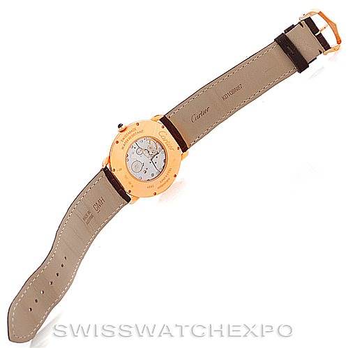 The image shows the back side of a Ronde model watch by Cartier, highlighting the case back and leather straps.