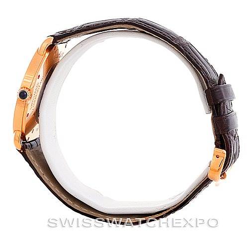 This side view of the Ronde by Cartier shows the watch case, crown, leather strap, and buckle.