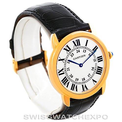 The image shows a Cartier Ronde W6700455 Men's Steel and Gold (two tone) Silver Dial W6700455 Men's Steel and Gold (two tone) Silver Dial watch at an angle focusing on the face and leather strap.