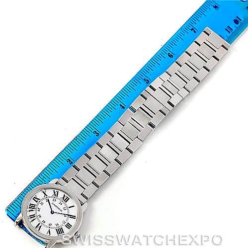 The image shows the Cartier Ronde W6701005 Men's Stainless Steel Silver Dial W6701005 Men's Stainless Steel Silver Dial watch laid flat next to a blue ruler, displaying the watch face and the length of the metal bracelet.