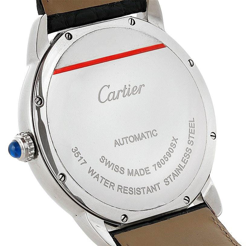 The image shows the back case of a Cartier Ronde W6701010 Men's Stainless Steel Silver Dial W6701010 Men's Stainless Steel Silver Dial watch, highlighting the inscriptions and leather strap attachment.