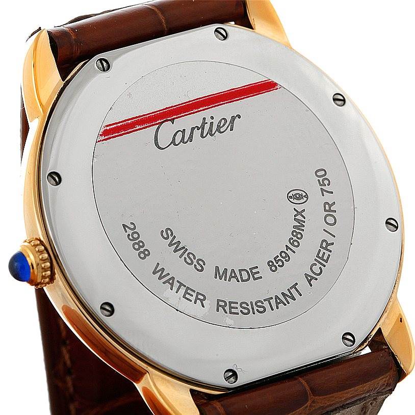 This image shows the back of a Cartier Ronde W6700455 Men's Steel and Gold (two tone) Silver Dial W6700455 Men's Steel and Gold (two tone) Silver Dial watch, featuring the case back, screws, crown, and part of the leather strap.