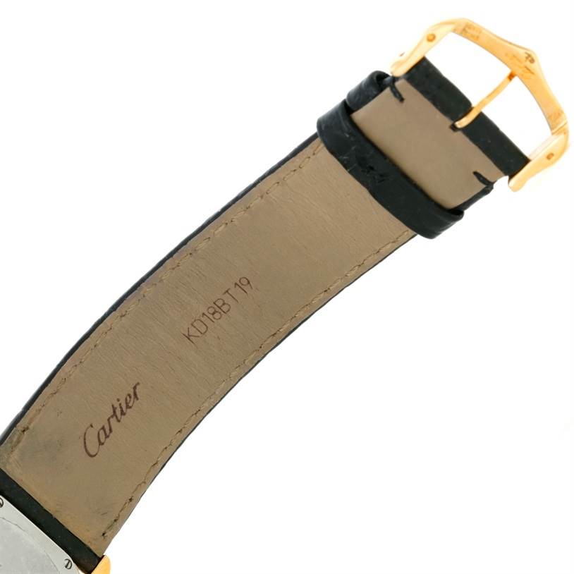 The image shows the buckle and strap of a Cartier Ronde W6700455 Men
s Steel and Gold (two tone) Silver Dial W6700455 Men
s Steel and Gold (two tone) Silver Dial watch from the back, highlighting the leather material and the branding.