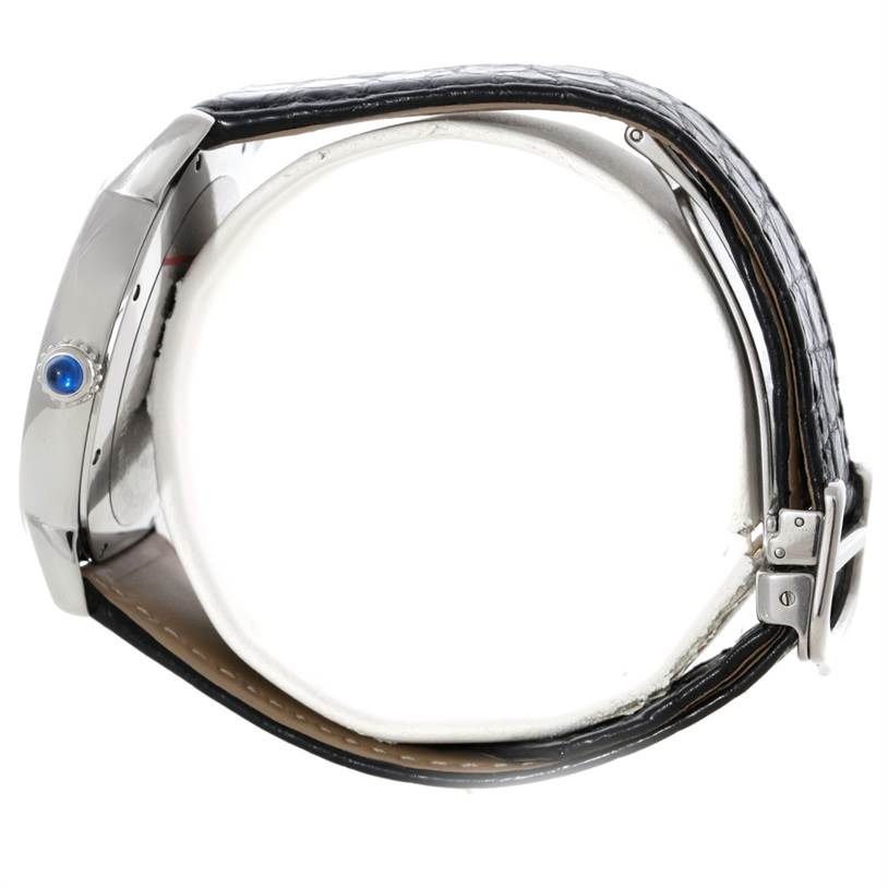 The image shows a side view of the Cartier Ronde W6701010 Men's Stainless Steel Silver Dial W6701010 Men's Stainless Steel Silver Dial watch, highlighting the crown with a blue cabochon and the leather strap.