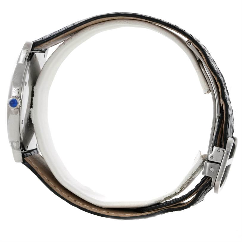This side-angle view of the Cartier Ronde W6700255 Men
s Stainless Steel Silver Dial W6700255 Men
s Stainless Steel Silver Dial watch shows its case, crown, and partially open leather strap.
