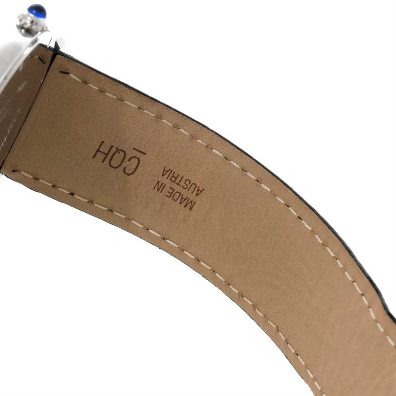 The image shows the underside of the strap and part of the crown of a Cartier Ronde W6700255 Men
s Stainless Steel Silver Dial W6700255 Men
s Stainless Steel Silver Dial watch.