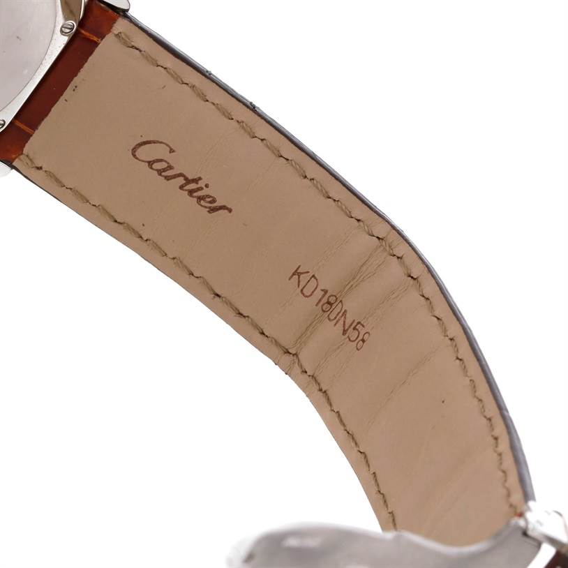 The image shows the inside of a leather strap and part of the caseback of a Cartier Ronde W6700255 Stainless Steel Silver Dial W6700255 Stainless Steel Silver Dial watch.