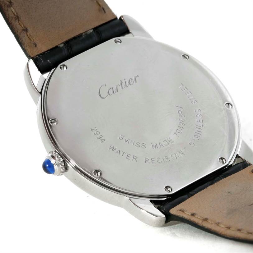 The image shows the back case and part of the leather strap of a Cartier Ronde W6700255 Stainless Steel Silver Dial W6700255 Stainless Steel Silver Dial model watch at an oblique angle.
