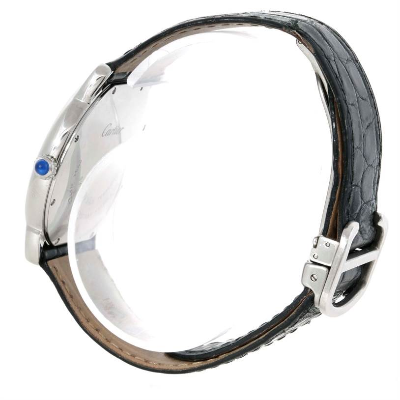 The image shows a side view of a Cartier Ronde W6700255 Stainless Steel Silver Dial W6700255 Stainless Steel Silver Dial model watch, highlighting the crown, buckle, and black leather strap.