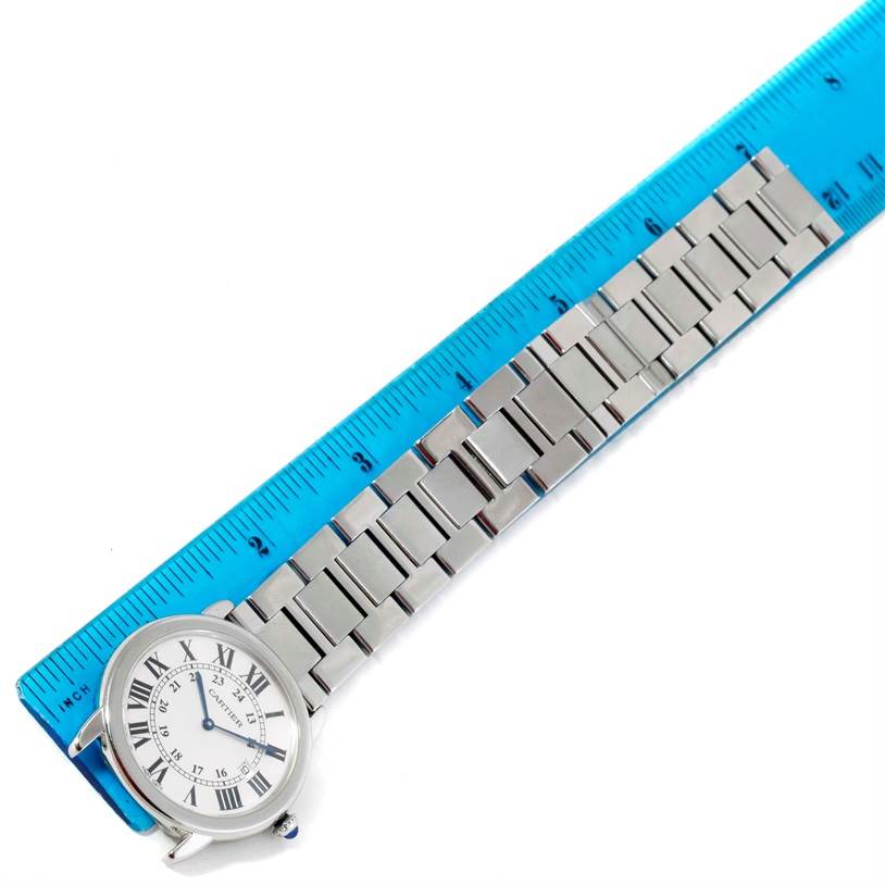 The Cartier Ronde W6701005 Men
s Stainless Steel Silver Dial W6701005 Men
s Stainless Steel Silver Dial watch is shown from an elevated angle, highlighting its face, case, and stainless steel strap.