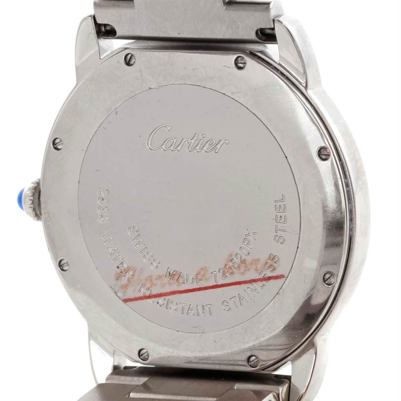 This image shows the back case of a Cartier Ronde W6701005 Men
s Stainless Steel Silver Dial W6701005 Men
s Stainless Steel Silver Dial watch, including its engravings and part of the metal bracelet.