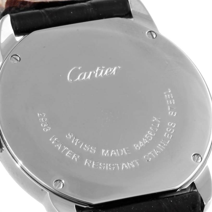 This image shows the back casing of a Cartier Ronde W6700155 Women
s Stainless Steel Silver Dial W6700155 Women
s Stainless Steel Silver Dial watch, highlighting engraved details and a portion of the strap.