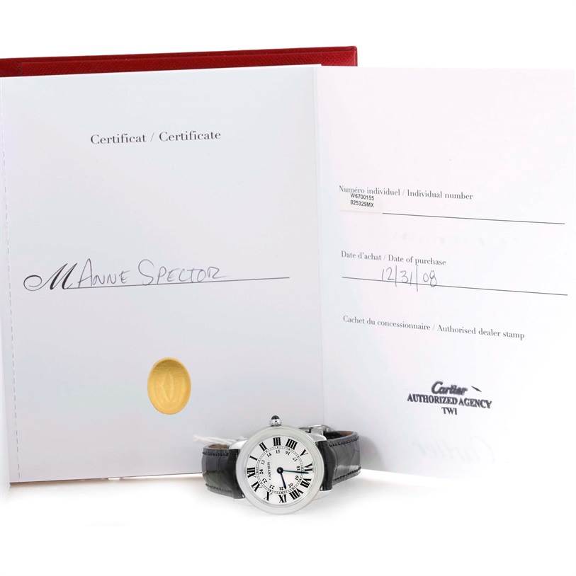 The image shows a Cartier Ronde W6700155 Women
s Stainless Steel Silver Dial W6700155 Women
s Stainless Steel Silver Dial watch lying flat with its warranty certificate in the background.