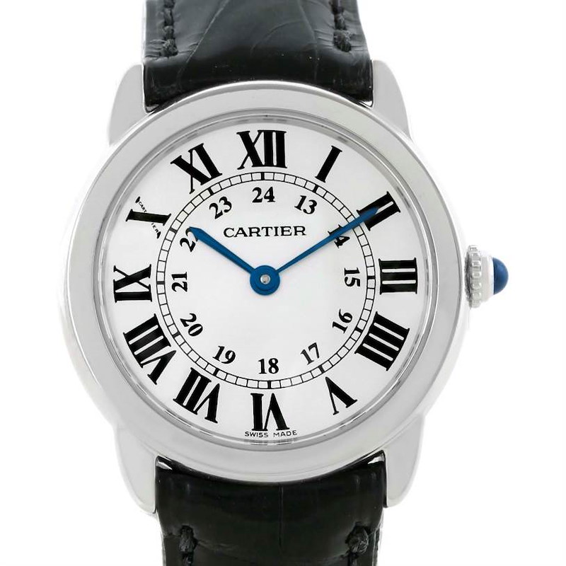 The Cartier Ronde model watch is shown from the front, displaying its dial, Roman numerals, blue hands, and leather strap.