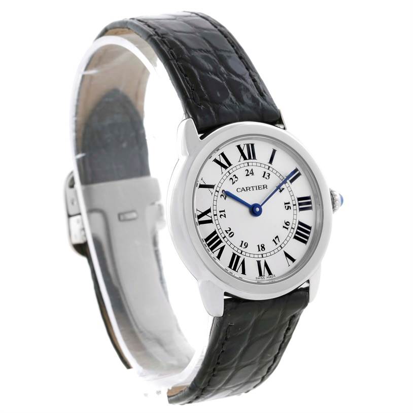 The image shows a left-side angle of a Cartier Ronde W6700155 Women
s Stainless Steel Silver Dial W6700155 Women
s Stainless Steel Silver Dial watch, featuring its round face, Roman numerals, and black leather strap.