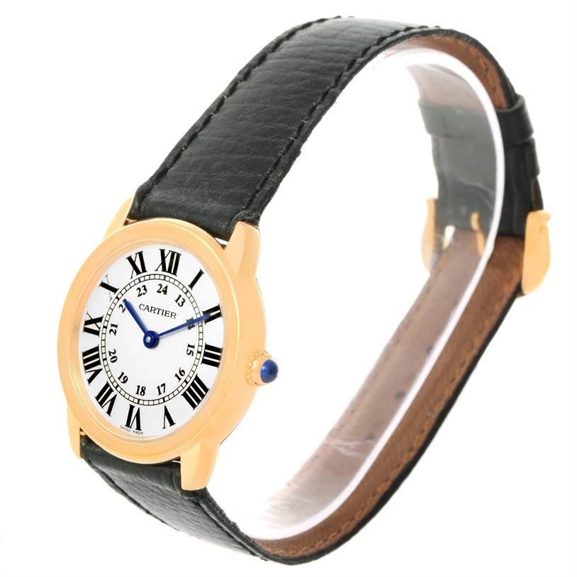 This image shows a Cartier Ronde W6700355 Women's Steel and Gold (two tone) Silver Dial W6700355 Women's Steel and Gold (two tone) Silver Dial watch from a side angle, displaying its face, black leather strap, and gold casing.