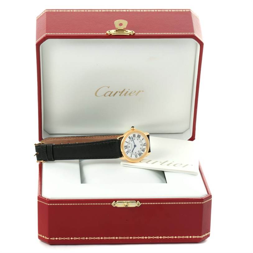 The Ronde model by Cartier is shown resting in its open red and white box, viewed from the front.