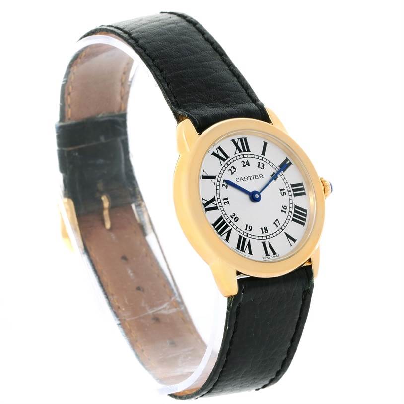 The Cartier Ronde W6700355 Women's Steel and Gold (two tone) Silver Dial W6700355 Women's Steel and Gold (two tone) Silver Dial model watch is shown at a slight angle highlighting its face, black leather strap, and gold case.