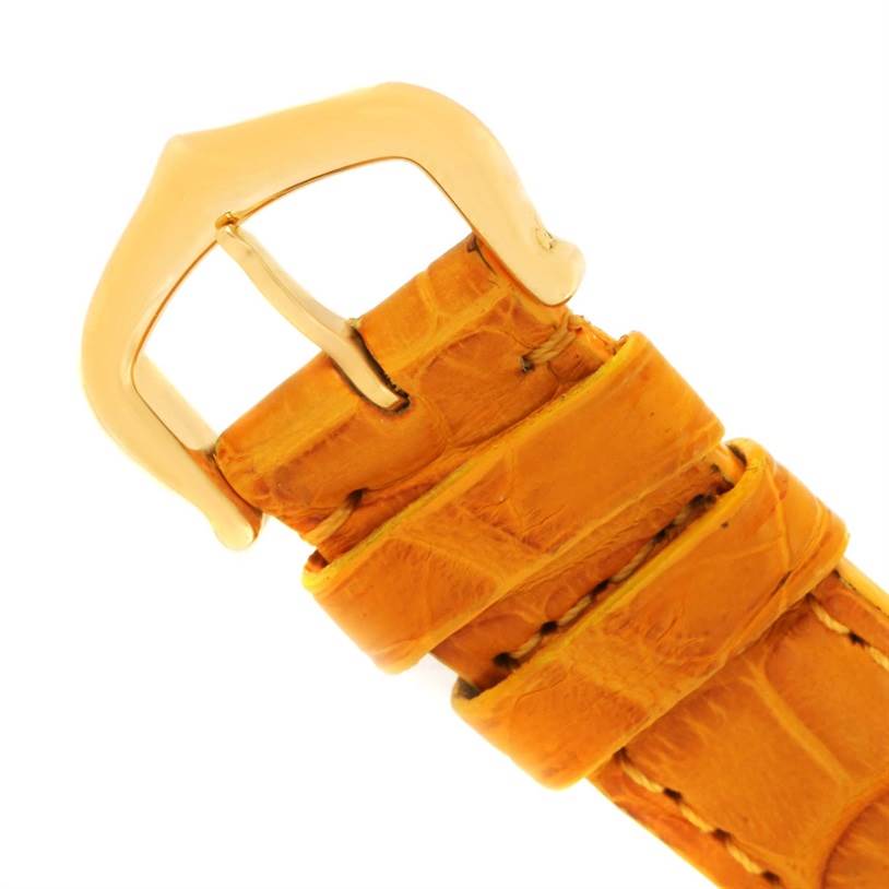 The image shows a close-up of the orange leather strap and gold buckle of a Cartier Ronde W6700355 Women's Steel and Gold (two tone) Silver Dial W6700355 Women's Steel and Gold (two tone) Silver Dial watch.