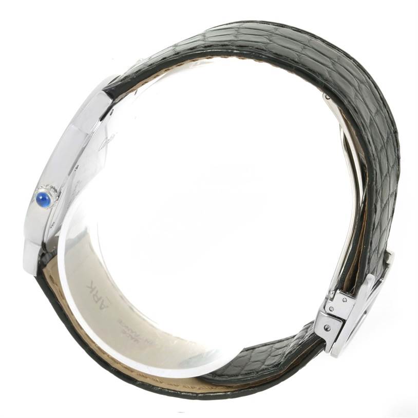 The image shows a side view of a Cartier Ronde W6700255 Stainless Steel Silver Dial W6700255 Stainless Steel Silver Dial watch, highlighting its case, crown, and leather strap.