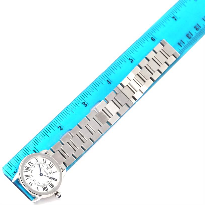The image shows the face and metal bracelet of a Cartier Ronde W6701004 Women
s Stainless Steel Silver Dial W6701004 Women
s Stainless Steel Silver Dial watch, aligned next to a ruler for scale.