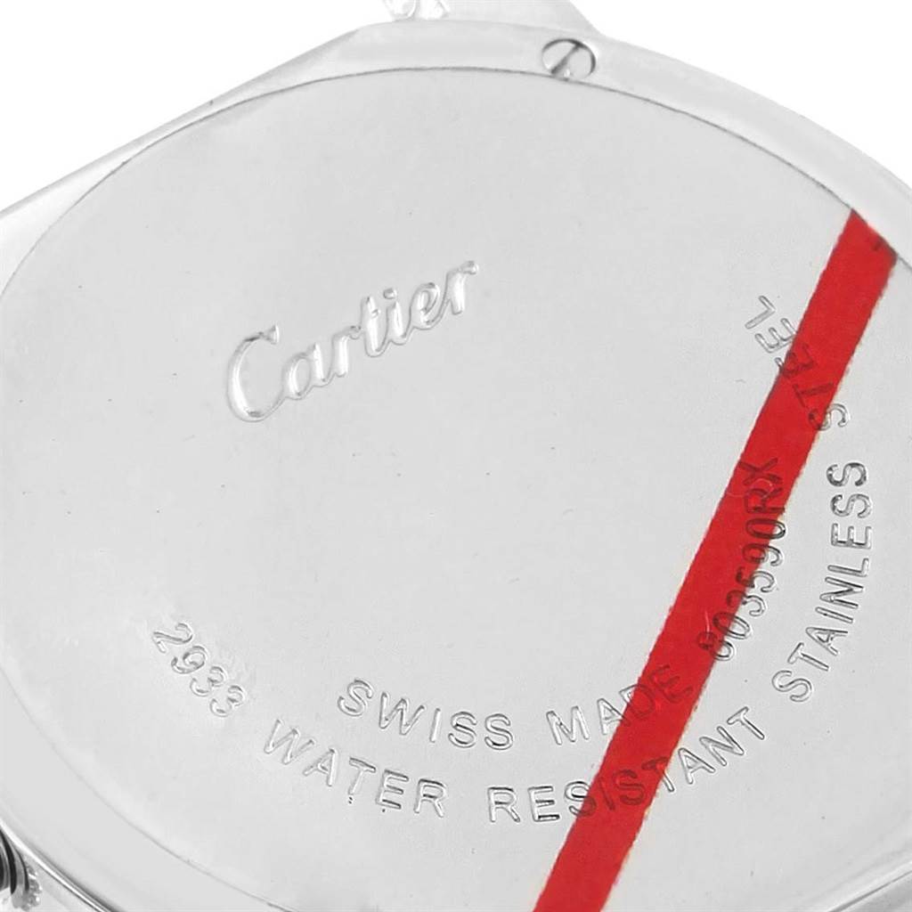 The image shows the back case of a Ronde model watch by Cartier, focusing on engravings and a red stripe.