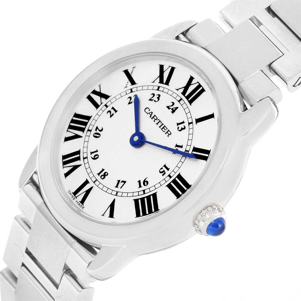 The image shows a Ronde model watch by Cartier from an oblique angle, highlighting the dial, crown, and part of the bracelet.