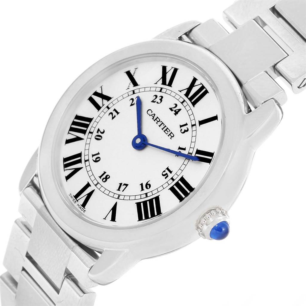 The image shows a close-up of the Cartier Ronde W6701004 Women's Stainless Steel Silver Dial W6701004 Women's Stainless Steel Silver Dial model watch, focusing on its face, bezel, and part of the metal bracelet.