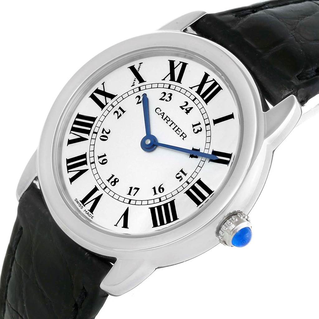 This image shows a close-up of the Cartier Ronde W6700155 Women's Stainless Steel Silver Dial W6700155 Women's Stainless Steel Silver Dial watch face, bezel, crown, and partial leather strap.