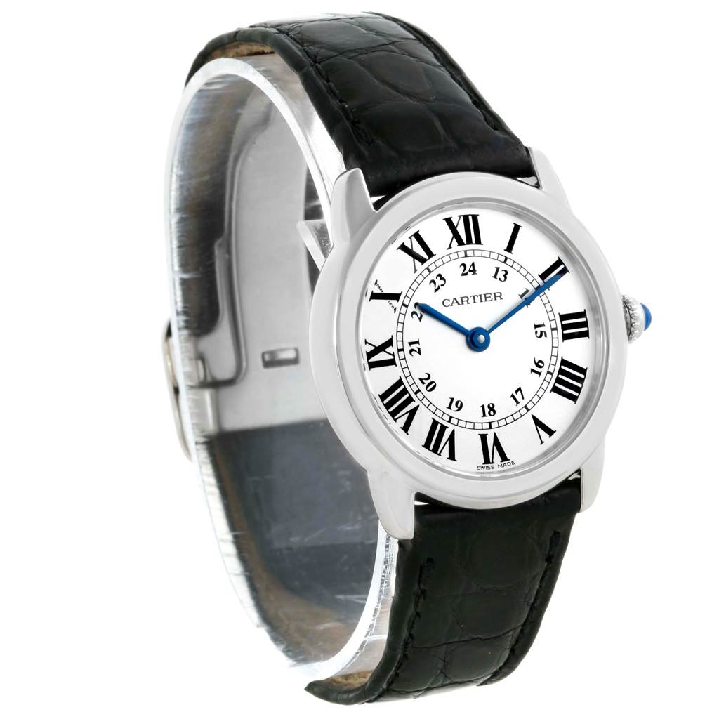 The Cartier Ronde W6700155 Women's Stainless Steel Silver Dial W6700155 Women's Stainless Steel Silver Dial watch is shown at a slight angle displaying its face, black leather strap, and part of the clasp.