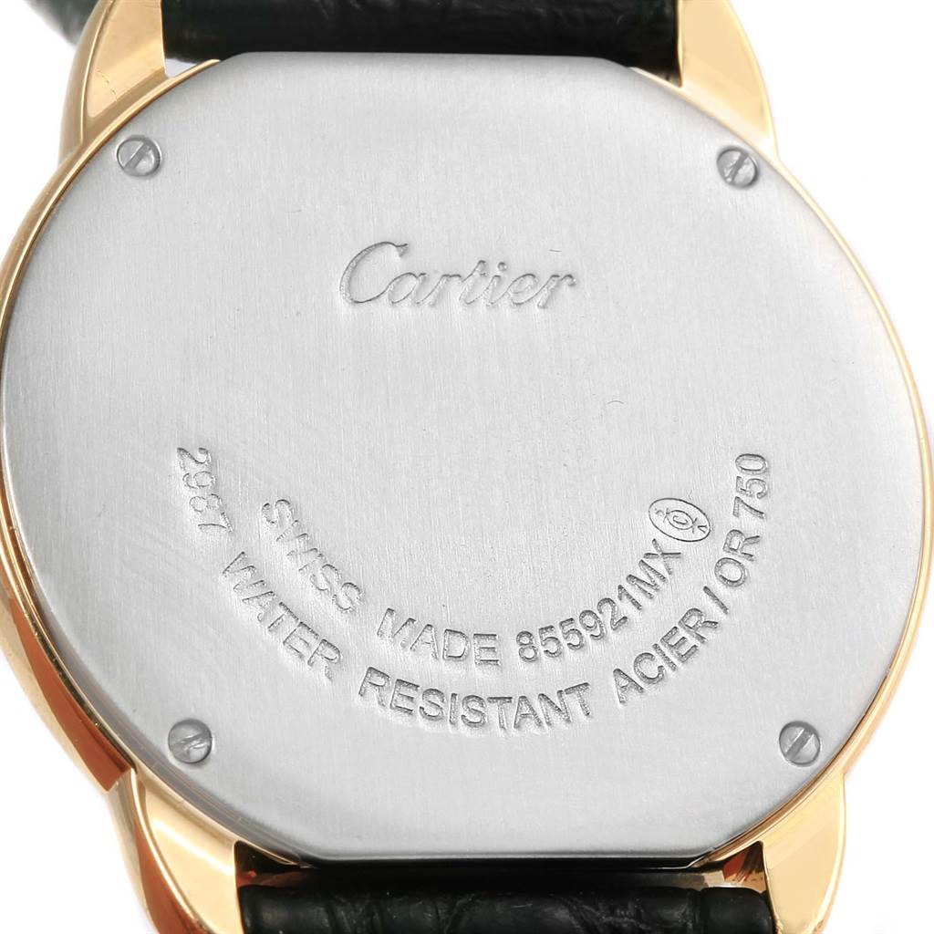 The image shows the back of a Ronde model by Cartier, displaying the case back with inscriptions and part of the leather strap.