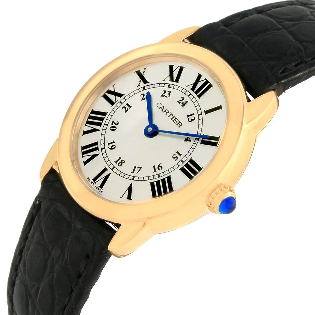 The Cartier Ronde W6700355 Women
s Steel and Gold (two tone) Silver Dial W6700355 Women
s Steel and Gold (two tone) Silver Dial watch is shown at an angled view, displaying its dial, Roman numeral indices, and black leather strap.