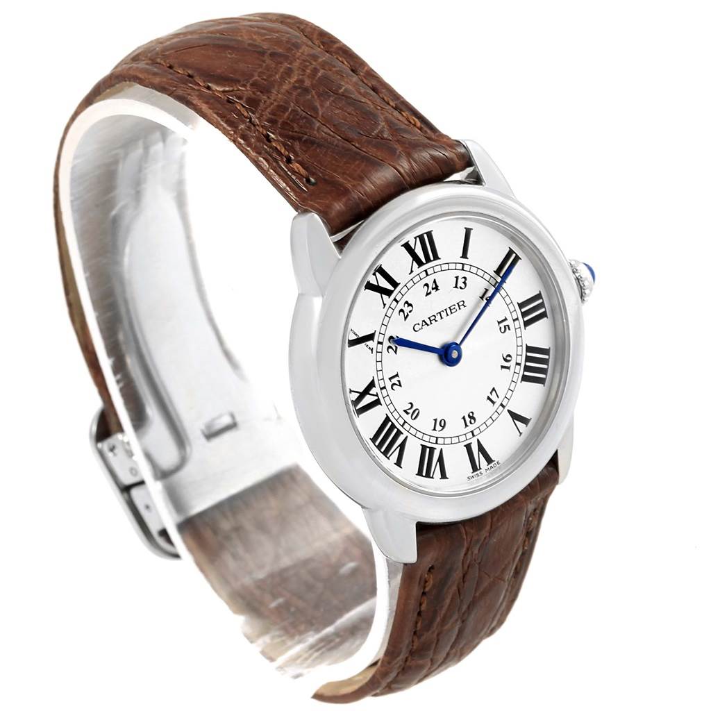 This image shows a Cartier Ronde W6700155 Women
s Stainless Steel Silver Dial W6700155 Women
s Stainless Steel Silver Dial watch at a three-quarter angle, highlighting its dial, case, and brown leather strap.