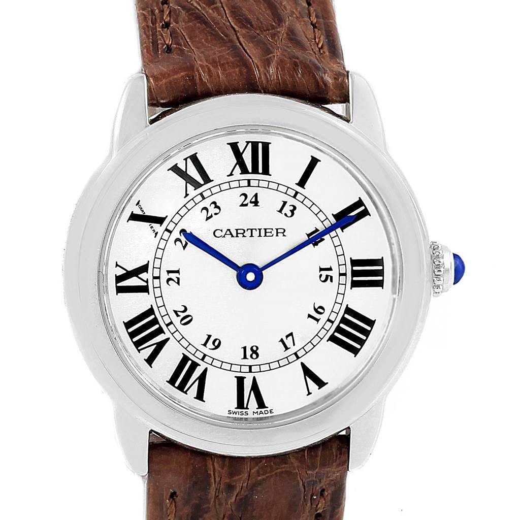 The image shows a frontal view of the Cartier Ronde W6700155 Women
s Stainless Steel Silver Dial W6700155 Women
s Stainless Steel Silver Dial watch, highlighting its face, Roman numerals, and brown leather strap.