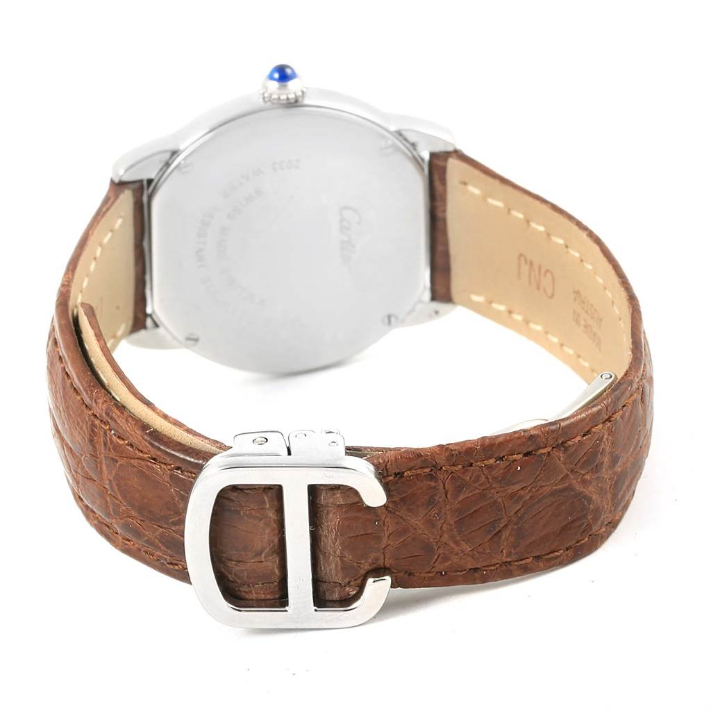 The image shows the back of a Cartier Ronde W6700155 Women
s Stainless Steel Silver Dial W6700155 Women
s Stainless Steel Silver Dial watch with a brown leather strap and a "C" shaped buckle.