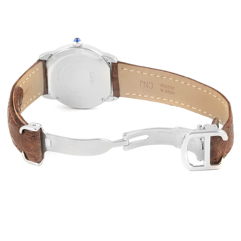 The image shows the backside of a Cartier Ronde W6700155 Women
s Stainless Steel Silver Dial W6700155 Women
s Stainless Steel Silver Dial watch, including the brown leather strap and deployment clasp.