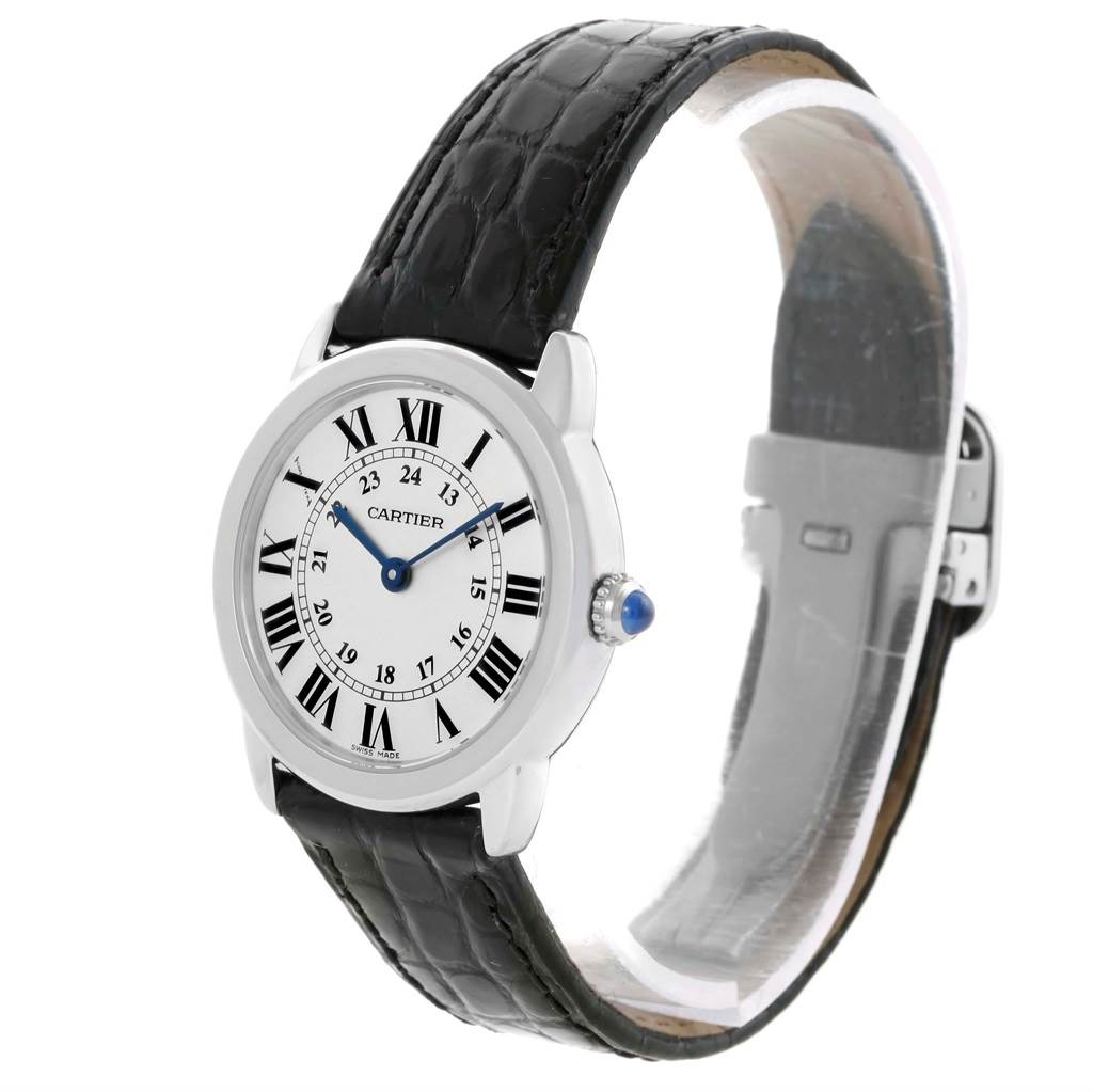 The Cartier Ronde W6700155 Women's Stainless Steel Silver Dial W6700155 Women's Stainless Steel Silver Dial watch is shown at a slight angle, displaying both its face and leather strap.