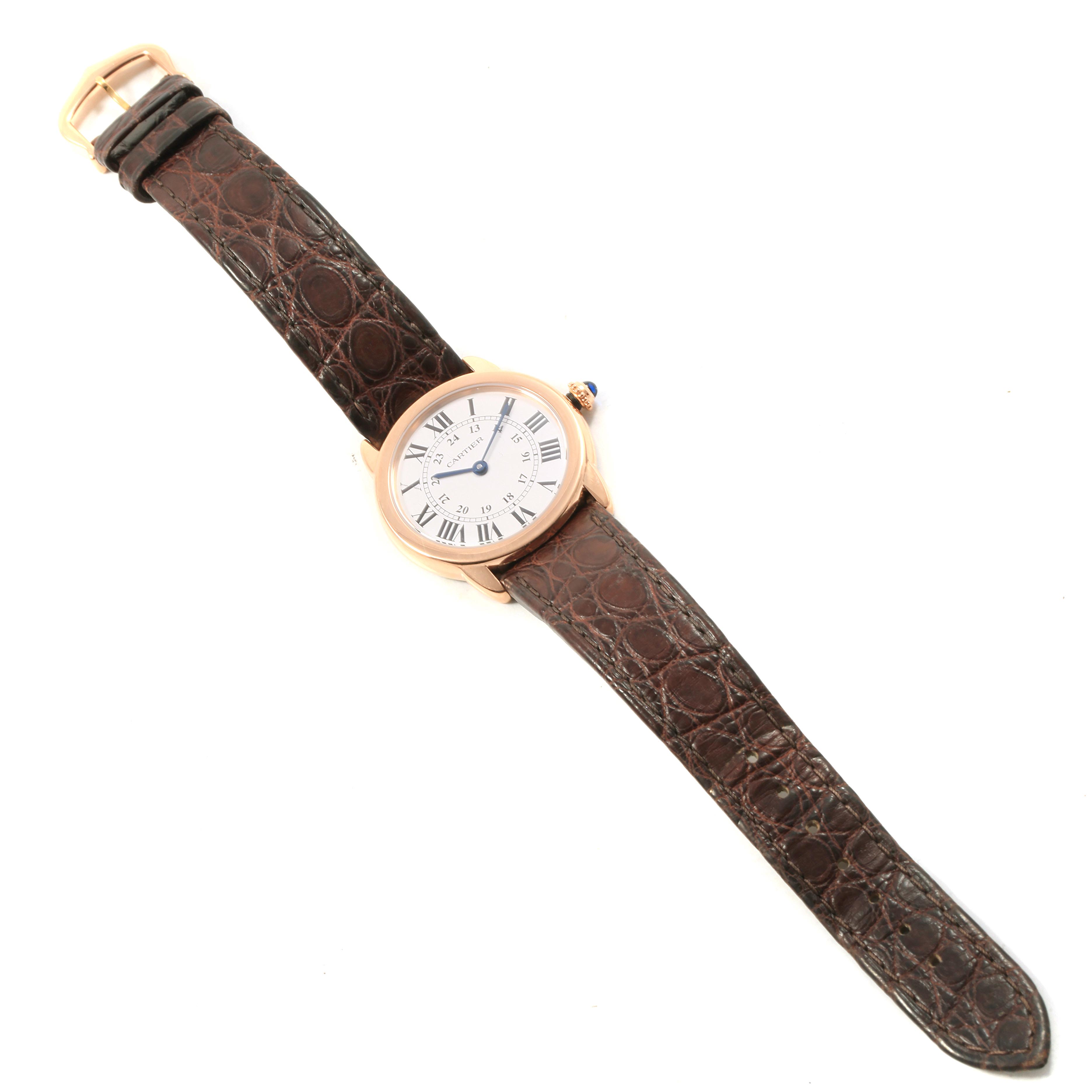 The Cartier Ronde W6701007 Women's Steel and Gold (two tone) Silver Dial W6701007 Women's Steel and Gold (two tone) Silver Dial watch is shown from the top, displaying the entire watch face and brown leather strap.