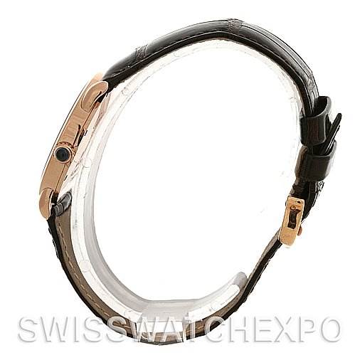 The image shows a side profile of a Cartier Ronde W6800151 Women
s Rose Gold Silver Dial W6800151 Women
s Rose Gold Silver Dial watch, highlighting its black leather strap and gold buckle.