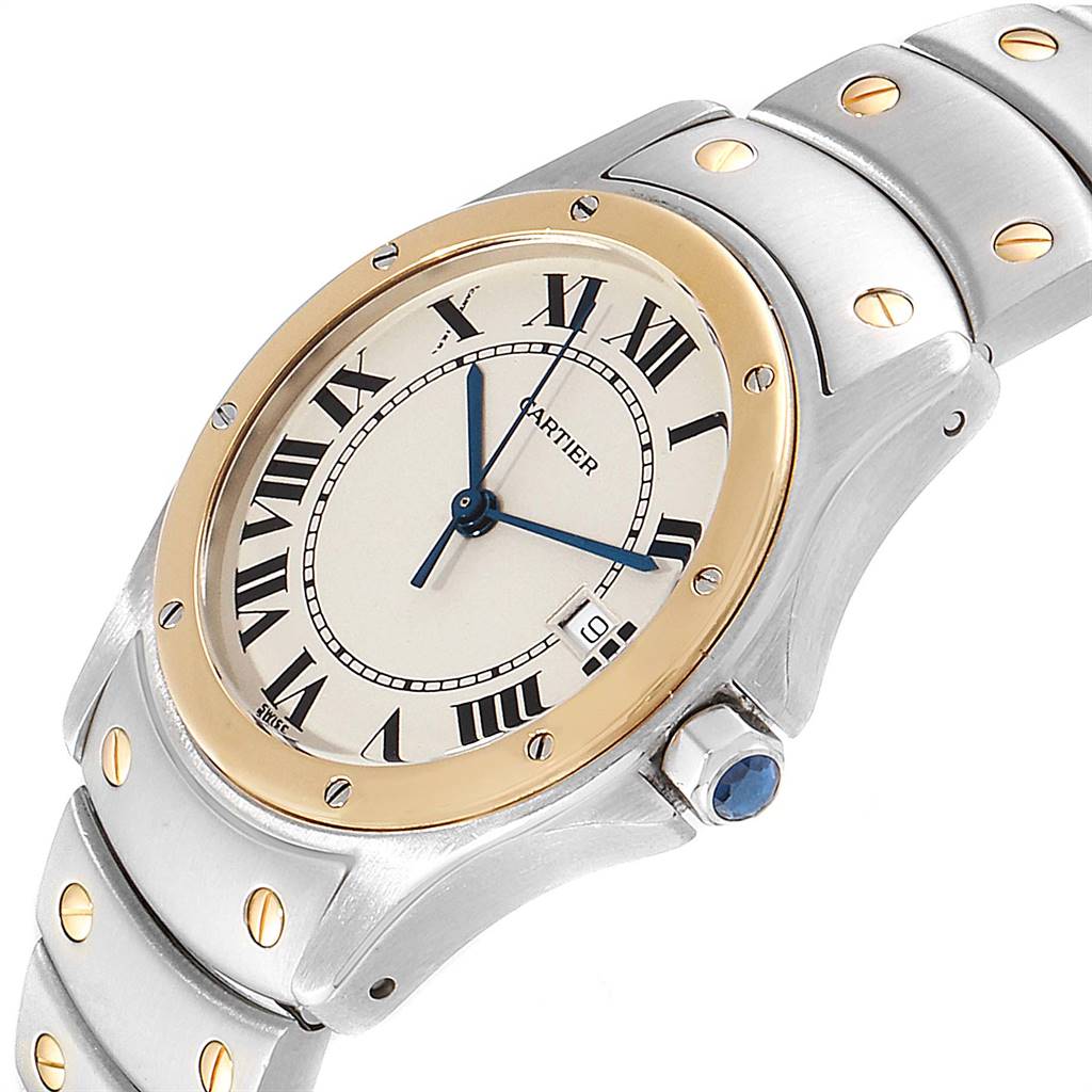 This image shows a close-up of a Cartier Ronde W20028G1 Steel and Gold (two tone) Silver Dial W20028G1 Steel and Gold (two tone) Silver Dial watch, displaying its dial, bezel, bracelet, and crown with a blue gemstone.