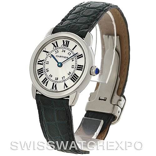 The image shows a side angle view of the Cartier Ronde W6700155 Women's Stainless Steel Silver Dial W6700155 Women's Stainless Steel Silver Dial model watch, displaying its face, Roman numeral dial, black leather strap, and clasp.