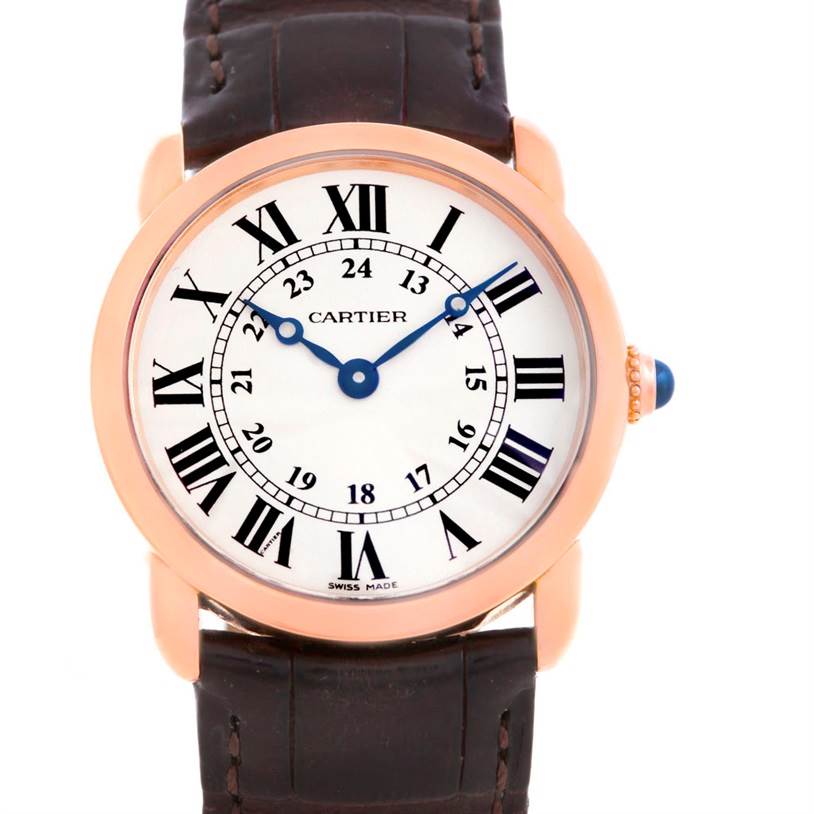 The image shows a frontal view of a Ronde model watch by Cartier, featuring a leather strap and Roman numeral dial.