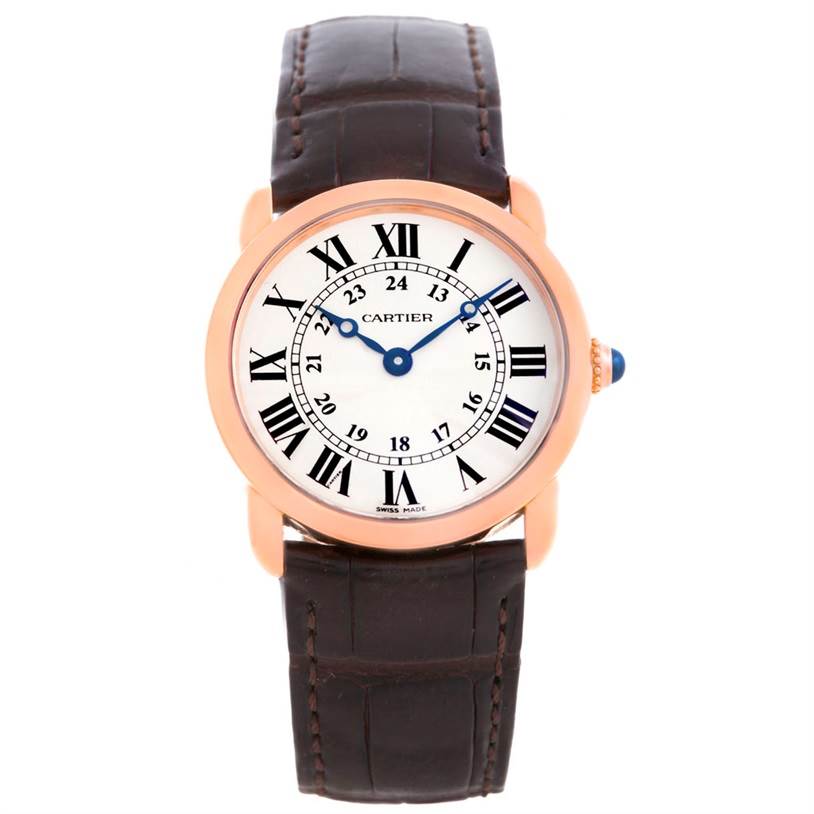 The image shows a front view of a Cartier Ronde W6800151 Women
s Rose Gold Silver Dial W6800151 Women
s Rose Gold Silver Dial model watch, featuring a white dial with Roman numerals and a brown leather strap.