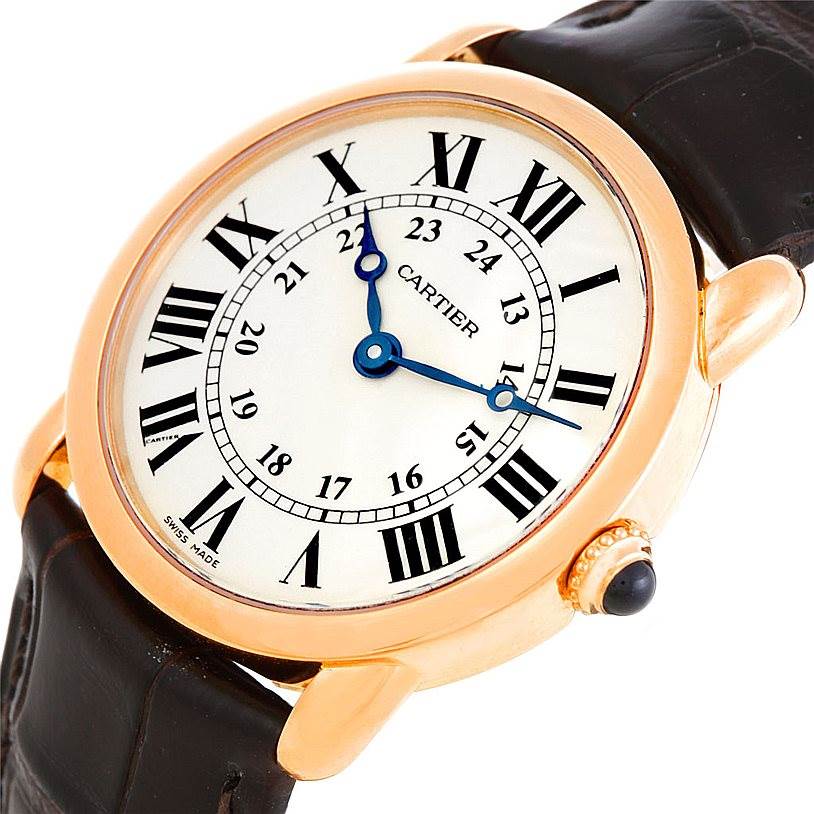 This image shows a close-up of a Cartier Ronde W6800151 Men
s Rose Gold Silver Dial W6800151 Men
s Rose Gold Silver Dial model watch, featuring its dial, hands, crown, and part of the leather strap.